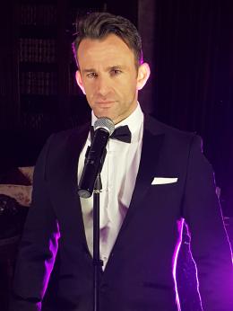 Our very own suited and handsome James Bond ready to entertain guests