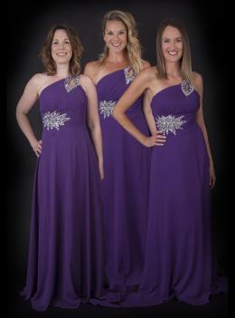Three girls in long purple gowns