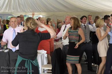 Undercover singing waitress turning the wedding breakfast into a party with guests all on their feet