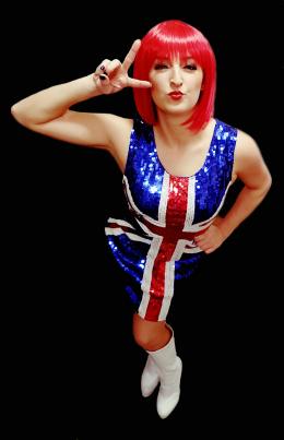 One of our performers dressed for our 90s tribute show in a red wig, white knee high boots and union jack dress